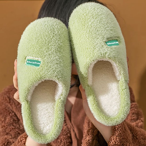Custom logo / brand Green slippers held by a person